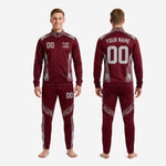 Custom maroon soccer tracksuit pants close-up showing silver hex geometric panel on thigh and tapered leg with elastic waistband