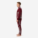 Custom maroon soccer tracksuit side profile showing full-dye sublimated hex panel detail on tapered track pants and full-zip jacket