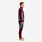 Maroon soccer tracksuit side view showing sky blue splash panel running from shoulder to pant leg
