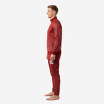 Custom maroon soccer tracksuit side profile view showing ribbed cuffs, stand collar full-zip jacket and matching dot-burst pants