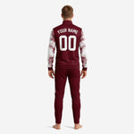 Full-zip maroon soccer tracksuit with stand collar and ribbed cuffs, front-facing detail on male model