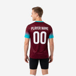 Custom maroon and teal soccer training jersey back view showing player number and name print zones