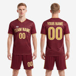 Back view of custom maroon and gold geometric soccer uniform set showing player name and number placement