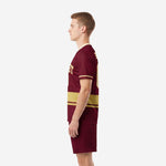 Custom maroon soccer uniforms back angle view showing player name and number print zones on maroon jersey and matching shorts