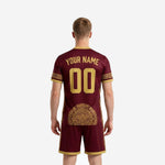 Maroon and Athletic Gold custom soccer kit showing geometric gold panel detail on jersey and shorts