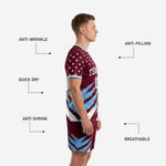 Custom maroon soccer uniform shorts detail showing sublimated sky blue slash design and player number print on leg