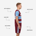 Maroon custom soccer uniform shorts with sky blue side stripe and white accent detail