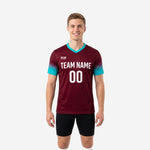 Custom maroon soccer training jersey with teal gradient sleeves and white team name and number on chest, front view on male model