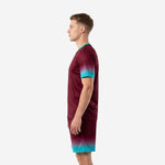 Mens custom maroon soccer uniform side profile showing full teal to maroon gradient on jersey and shorts