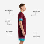 Custom maroon and teal soccer shorts with gradient hem and player number sublimated on leg