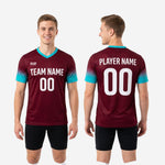 Teal V-neck trim detail on custom maroon soccer training jersey showing colour match to sleeve gradient