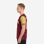 Custom maroon soccer jersey right side view displaying player name and back number in Vegas Gold sublimation print