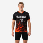 Custom mens soccer practice jersey in Jet Black with orange fire sublimation print and team name on chest, front view