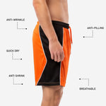 Hem detail of custom mens soccer shorts showing straight hem finish on orange and black sublimated shorts