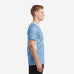 Left side view of custom men's soccer team jersey showing white breathable mesh side panel and short sleeve cut