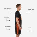 Matching black and orange sublimated soccer shorts showing tapered stripe panel on outer leg and elastic waistband with drawcord