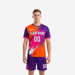 Custom men's soccer team uniforms in orange and royal purple splash print, front view, full 2-piece kit