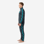 Close side angle of Charcoal and Teal custom mens soccer tracksuit highlighting the Teal checker panel detail on sleeve and pant leg
