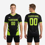 Front detail of black neon green mens soccer training jersey showing V-neck trim and geometric side panels