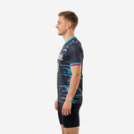 Custom mens soccer training jersey charcoal base with teal and fuchsia horizontal stripe burst pattern chest detail