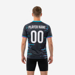 Custom mens soccer training jersey charcoal teal fuchsia back view showing player name and number sublimated in white
