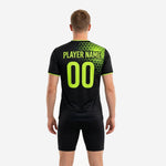 Close detail of neon green hex pattern on mens soccer training jersey showing full-dye sublimation coverage from shoulder to lower panel