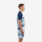 Men's soccer uniform set in digital camo with Navy Blue raglan sleeves, side profile showing jersey and matching shorts construction