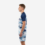 Custom men's soccer kit in Ice Blue and Navy Blue digital camo, side view showing full sublimation print coverage on jersey and shorts