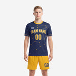 Custom men's soccer uniforms in Navy Blue with Athletic Gold constellation print and matching Athletic Gold shorts, front view