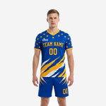 Custom men's soccer uniforms in Royal Blue and Athletic Gold with star-field shoulder print and diagonal slash graphic, front view