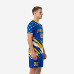 Custom men's soccer uniforms in Royal Blue and Athletic Gold showing slash graphic on jersey and matching shorts, left side view