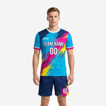 Custom men's soccer uniforms in sky blue with hot pink and canary yellow splash-pattern sublimation print, front view full kit