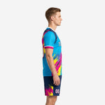 Custom men's soccer uniforms sky blue splash design side view showing navy blue shoulder panel and hot pink cuff trim