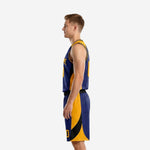 Side view of custom navy and gold basketball uniform showing the gold diagonal panel running up the jersey and through the shorts leg