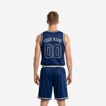 Right side view of custom navy basketball uniform set showing shorts side stripe and sleeveless jersey armhole and neckline trim in silver and white