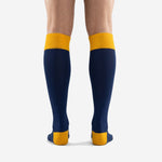 Detail view of custom blue and gold soccer socks highlighting the ribbed Athletic Gold cuff band construction