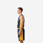 Left side view of navy blue sublimated basketball jersey and shorts with gold panel and V-neck collar detail