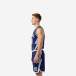 Custom navy blue basketball uniform opposite side view showing the full length of the silver lightning bolt graphic on the shorts leg