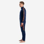 Custom Navy Blue and Orange soccer tracksuit right side profile showing tapered track pants with orange outer seam stripe and thigh number print