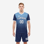 Custom Navy Blue and Sky Blue men's soccer uniforms with dot-burst gradient print, front view showing team name and number on jersey and matching shorts