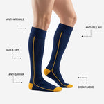Ribbed turnover cuff on custom navy blue soccer socks with gold piping running down the calf panel