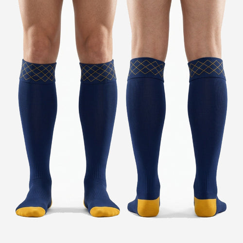 Complete pair of custom navy blue soccer socks with Athletic Gold diamond cuff and contrast toe and heel blocks