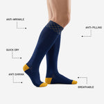 Full length profile of custom navy blue soccer socks showing over-the-calf fit covering shin guard length on adult model