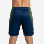 Back view of custom navy basketball shorts with lime-gold hex side panels and rear player number placement