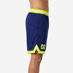 Custom navy basketball shorts with gold side panels side view showing panel width and mid-thigh length on adult male model