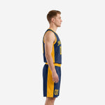 Front view of custom navy and gold basketball uniforms with gold side panels, V-neck collar, and sublimated chest number