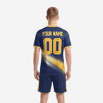 Custom soccer jersey in navy and gold with team name and number placement, close detail