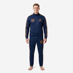 Custom navy and gold soccer tracksuit front view showing full-zip jacket and tapered pants with old gold chevron stripe panels on male model