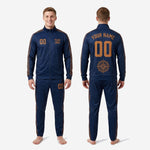 Custom navy and gold soccer tracksuit pants detail showing old gold chevron side panel and sublimated thigh number on tapered athletic cut