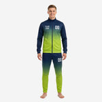 Custom navy blue and lime green gradient soccer tracksuit front view, full zip jacket and tapered pants with team logo and number printed by K2 Sportswear